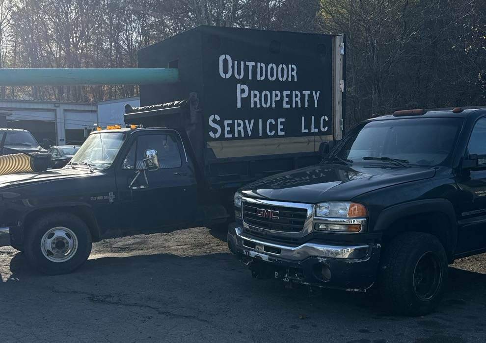 The Outdoor Property Services leaf box truck at the shop