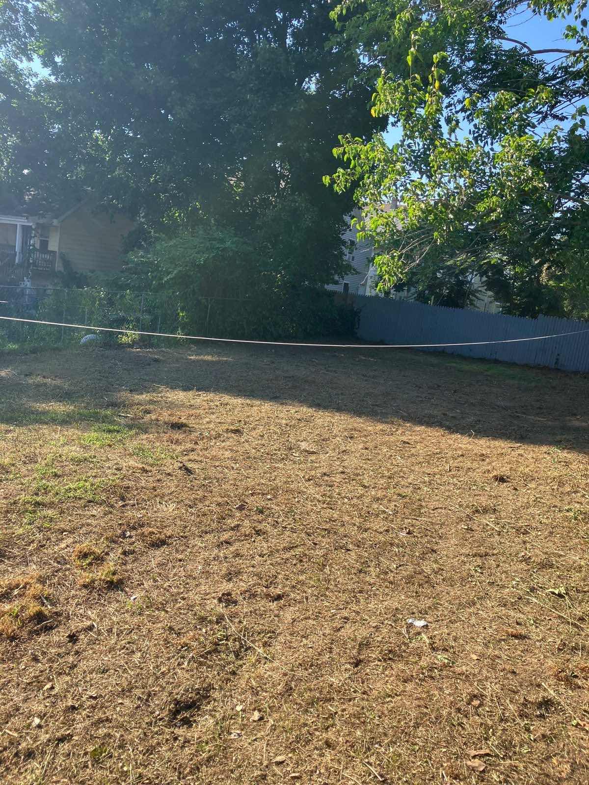 A New London, Connecticut, yard stripped, graded and raked out by Outdoor Property Services, ready for seed
