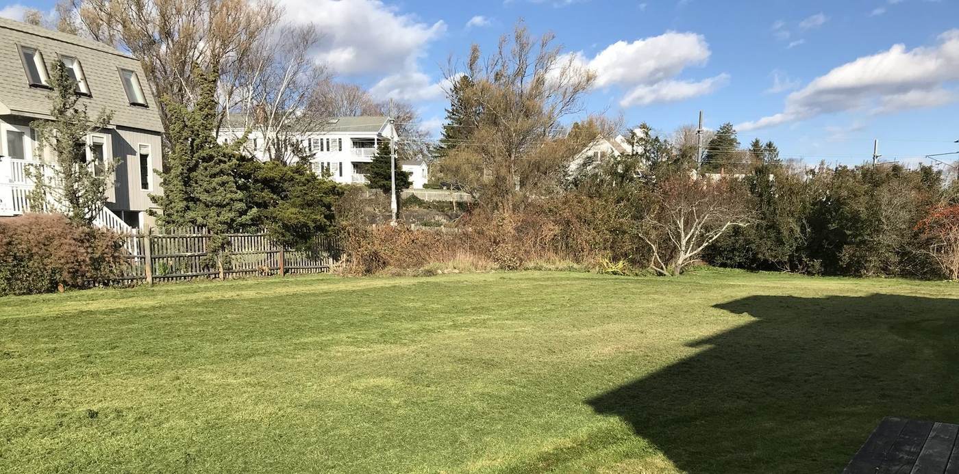An open shoreline lawn cut and cleaned off on a property in southeastern Connecticut by Outdoor Property Services